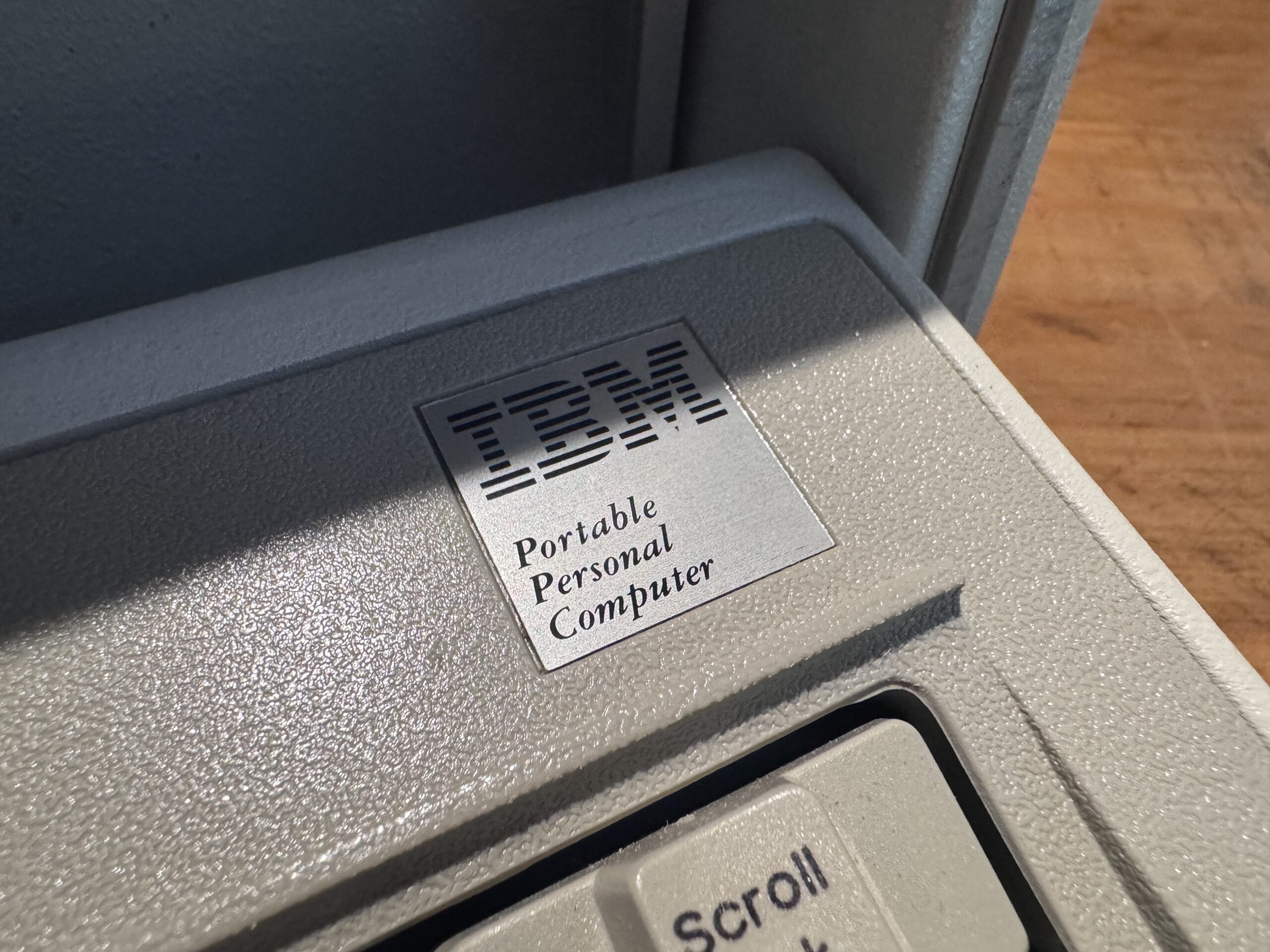 Detailed front view of the vintage IBM 5155 portable computer.