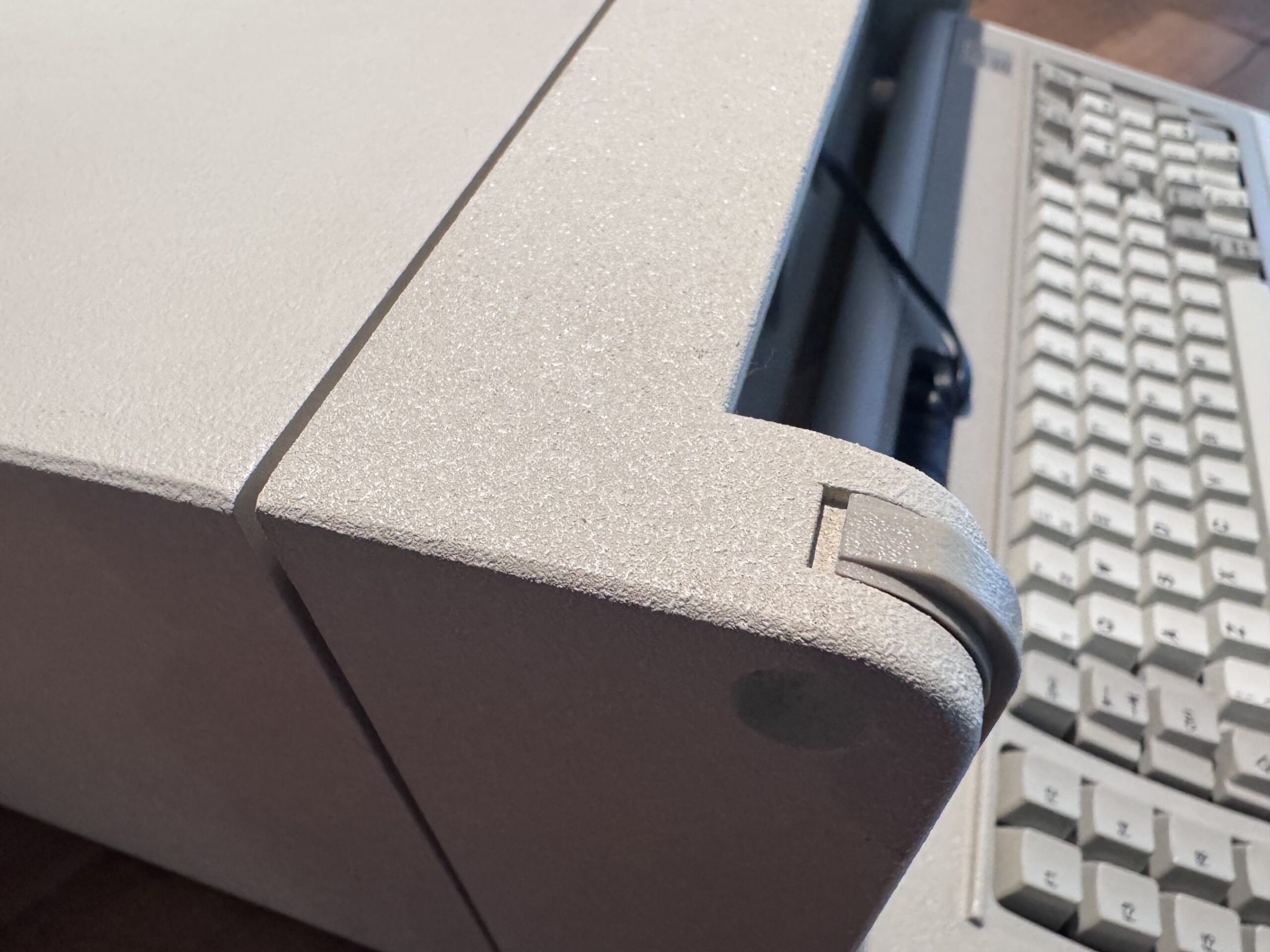 Side view of the IBM 5155 portable computer.