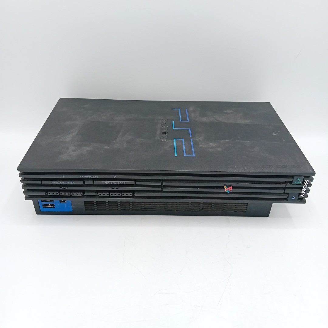 Front view of a black Sony PlayStation 2 console.
