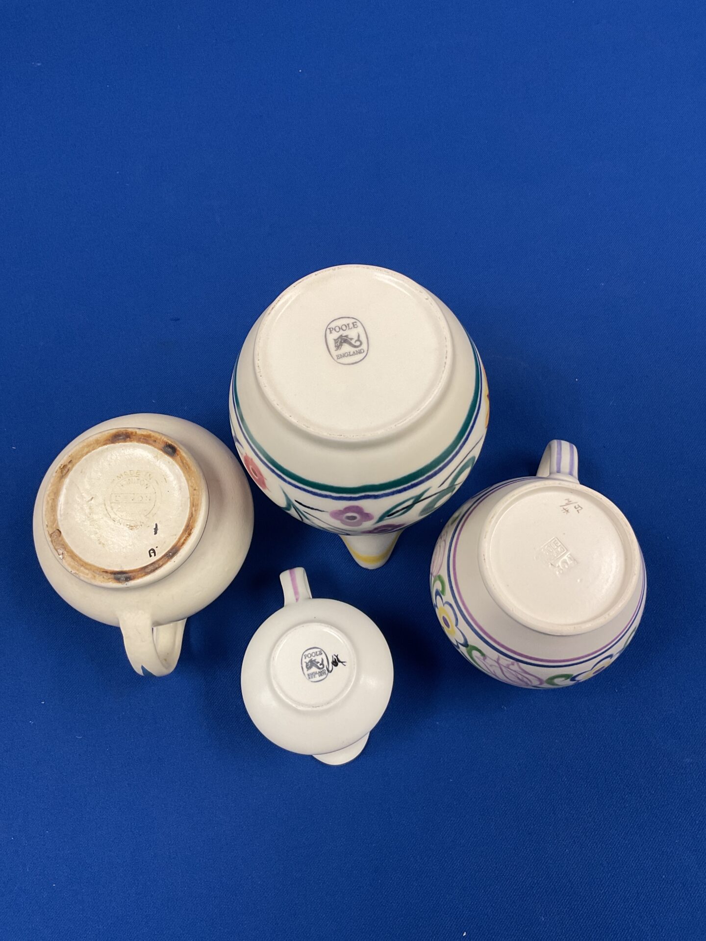 Close-up of a vintage Poole pottery jug with floral detail.