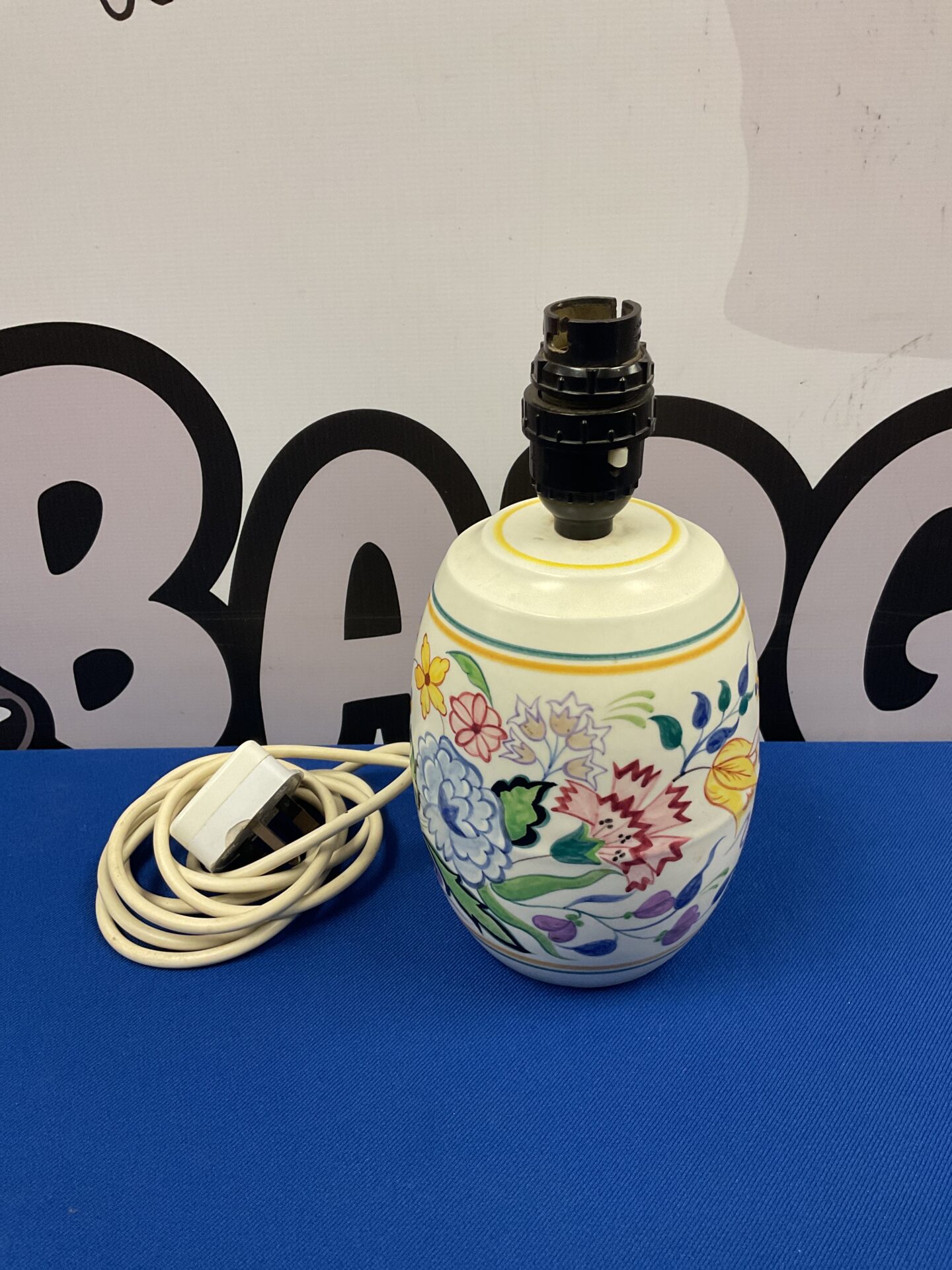 Vintage Poole Pottery table lamp with colourful floral design.