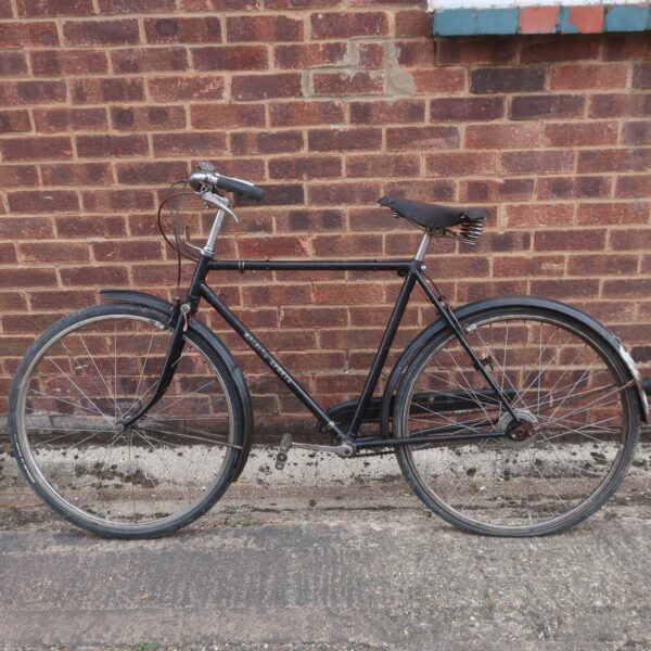 Side view of a vintage roadster bicycle in good condition.