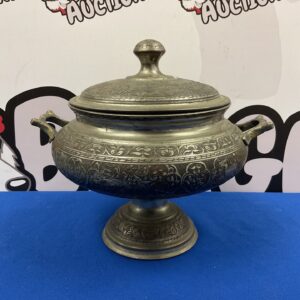 Large vintage silver plate pot with lid and detailed handles.